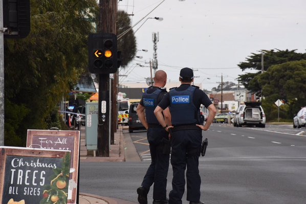 Police on the scene at a siege in Rye, around 100 kilometres south of Melbourne.