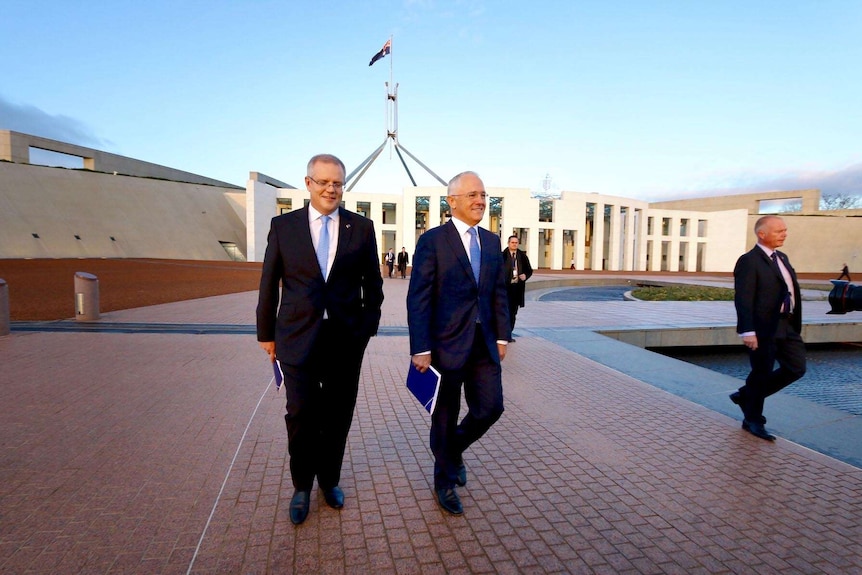 Scott Morrison and Malcolm Turnbull walking in front of Parliament House the day after the 2016 budget.