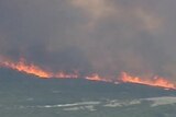 Ten metre high fires are threatening homes in Albany, WA.