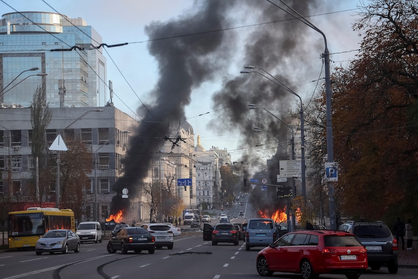 Two fires burn in a busy Kyiv street
