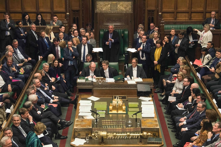 Lots of British MPs gather in the wood-panelled House of Commons to hear about a vote on Brexit.