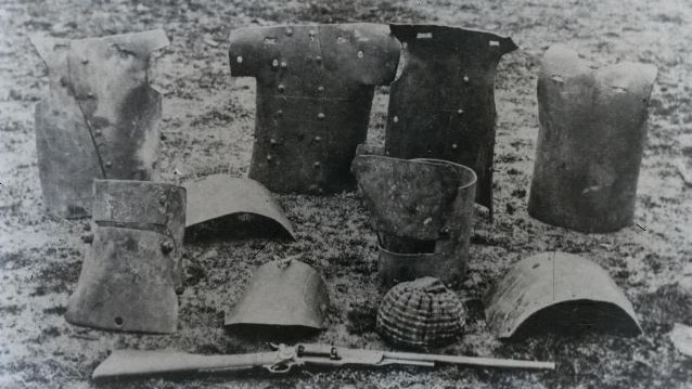 A black and white image of Ned Kelly's armour on the ground