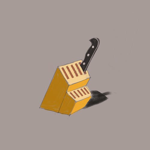An illustration shows a knife block.