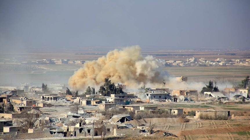 Smoke rises from buildings in Aleppo.