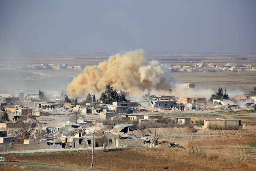 Smoke rises from buildings in Aleppo.