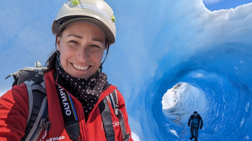 Marine scientist Jodi Salmond standing in front of a glacier in Antarctica.