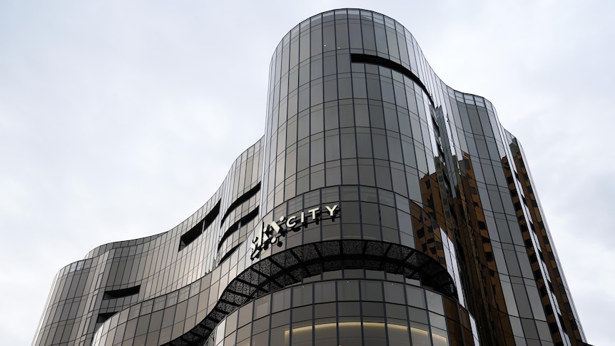 A large curved building with the skycity logo 