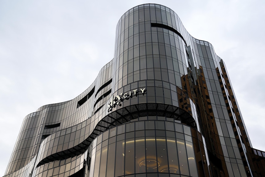 A large curved building with the skycity logo 