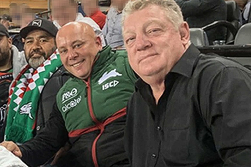 To'Oto'O Mafiti, Damion Flower and Phil Gould sit together and smile for the camera.