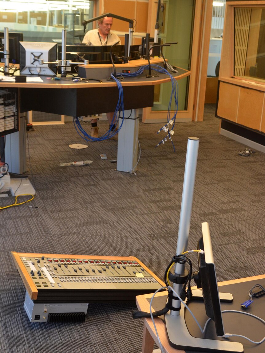A technician works in one of the ABC Radio studios at the ABC South Bank building.