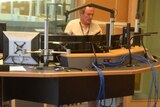 A technician works in one of the ABC Radio studios at the ABC South Bank building.