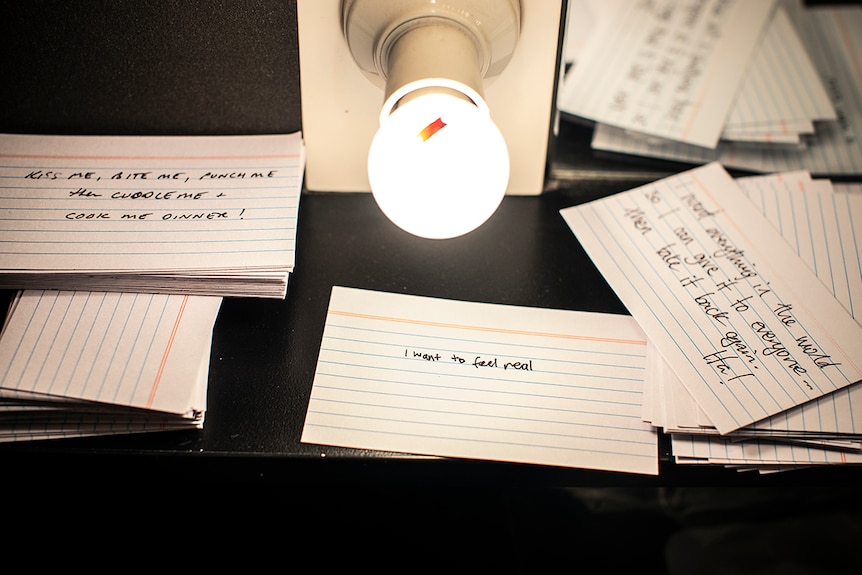 Colour photo of cue cards on dressing room table.