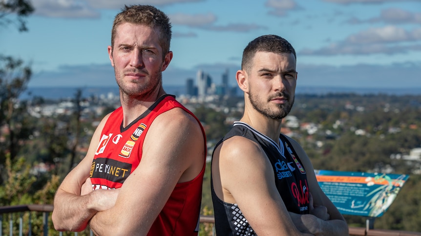 The Perth Wildcats and Melbourne United captains stand back to back with their arms folded.