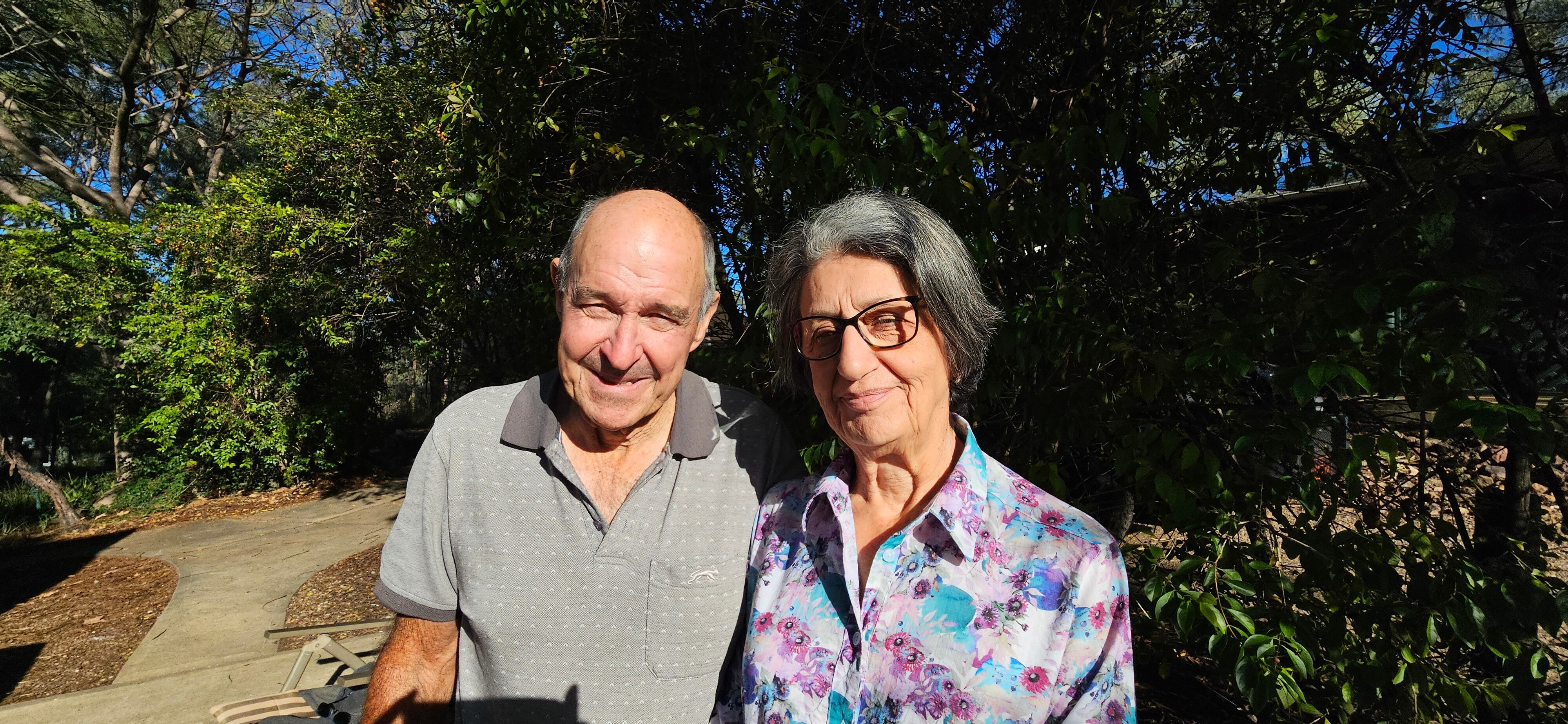 An older looking man and woman smiling
