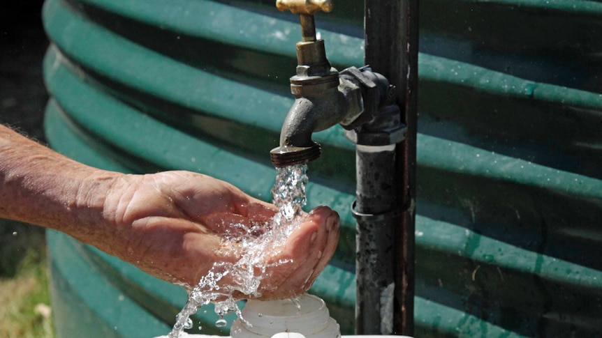 Water pours from a tank