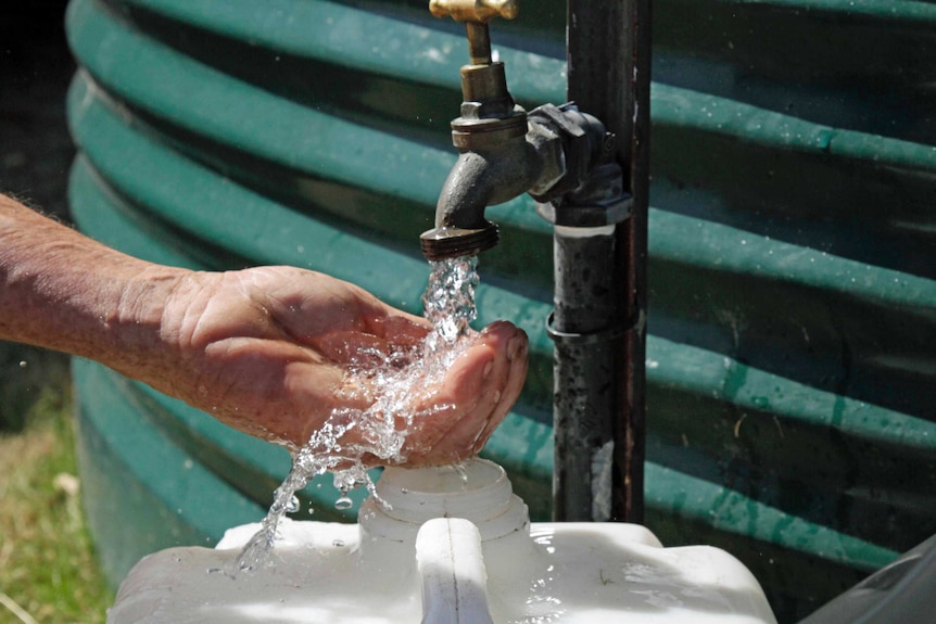 Water pours from a tank