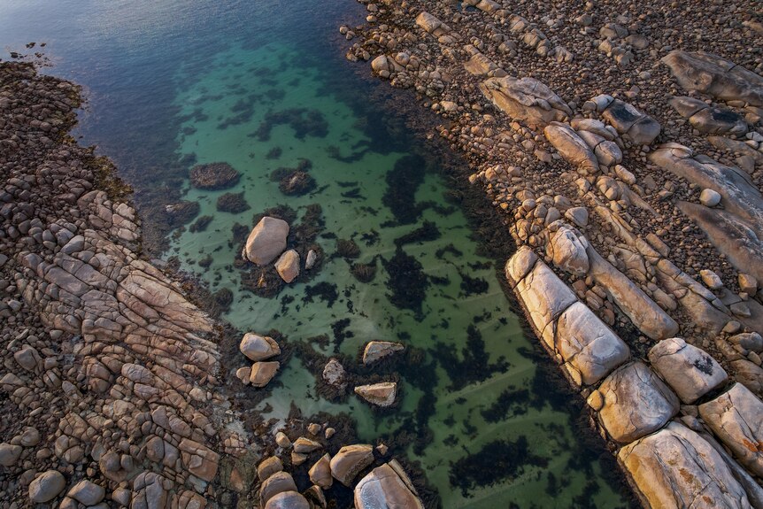 Shallow water between two rocky areas