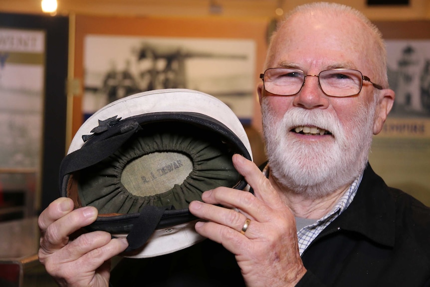 A former Naval officer Roger Dewar with his cap which has been returned to him after more than 50 years.
