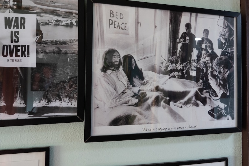 A framed photo of John Lennon and Yoko Ono's Bed-In for Peace protest in 1969.