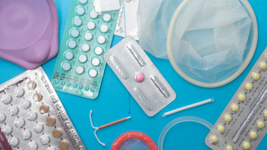 A flat lay of different contraception methods.