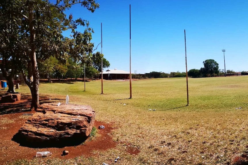 A grassy footy oval without any people