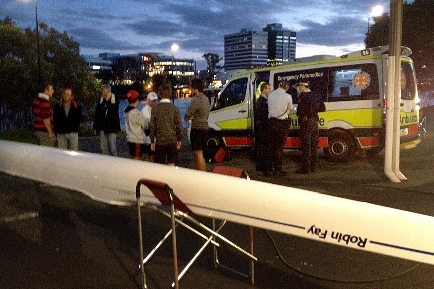 An ambulance sits at Commercial Rowing Club at South Brisbane after skull and CityCat collide.