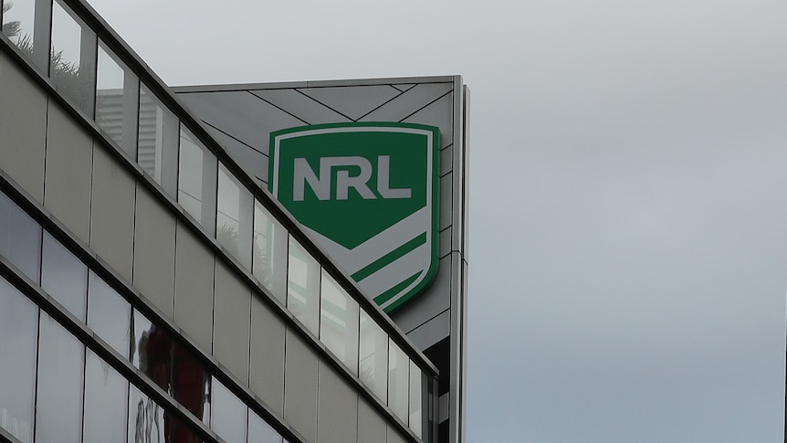 The NRL logo on a building with clouds above it