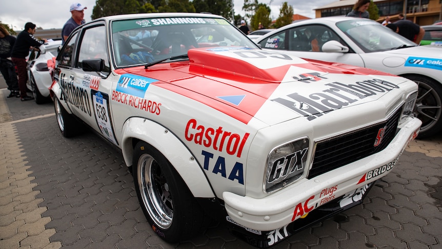 A racing car with sponsorship art work all over it