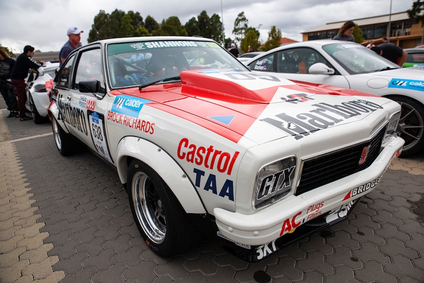 A racing car with sponsorship art work all over it