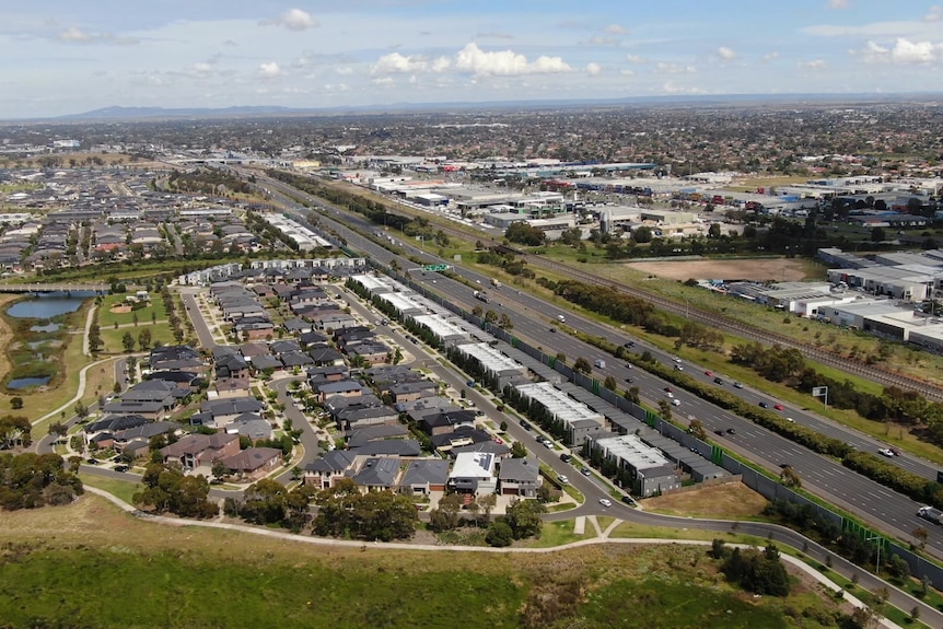 An aerial view of the an arterial road and the suburban homes at Werribee on Melbourne's western fringe.