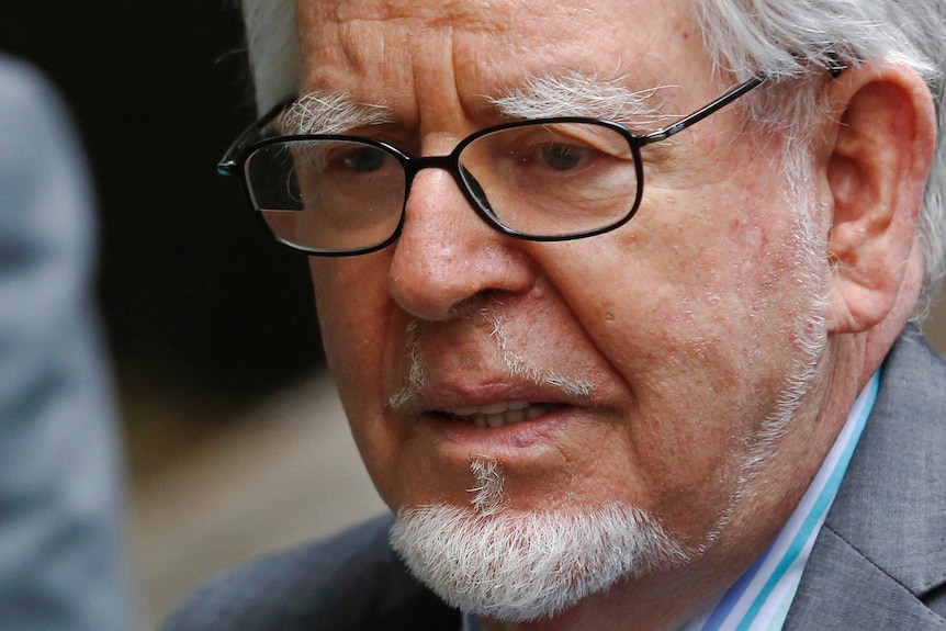 Rolf Harris leaves Southwark Crown Court in London after being found guilty.