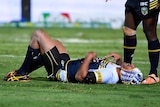 Defensive target ... Johnathan Thurston lays on the field after being hit against the Knights