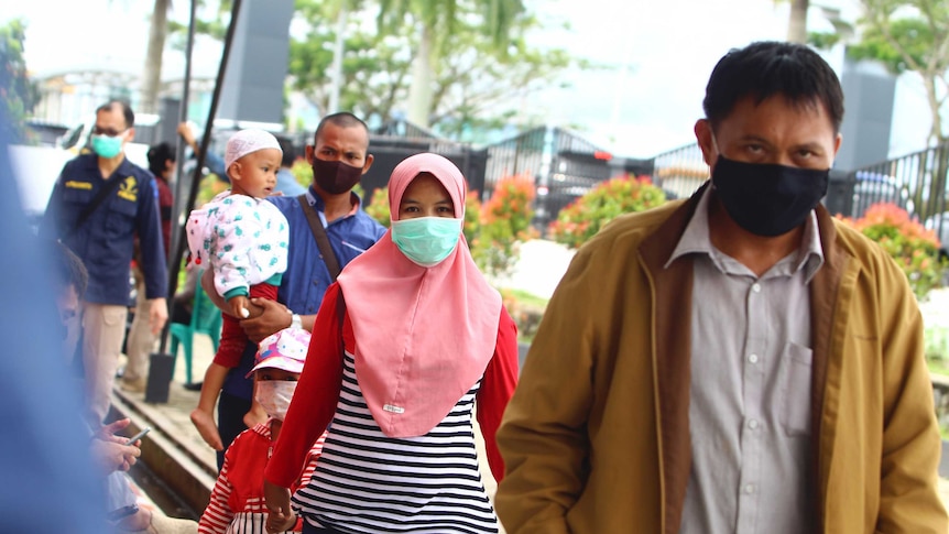 Family members of passengers of the Sriwijaya Air flight arrive at Pontianak airport