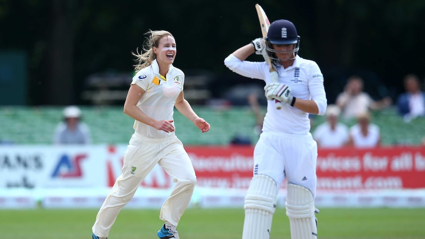 On song ... Ellyse Perry celebrates taking the wicket of England's Sarah Taylor
