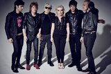 members of rock band blondie wearing jeans and leather jackets 