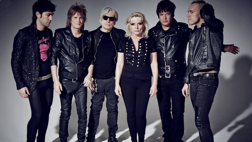 members of rock band blondie wearing jeans and leather jackets 