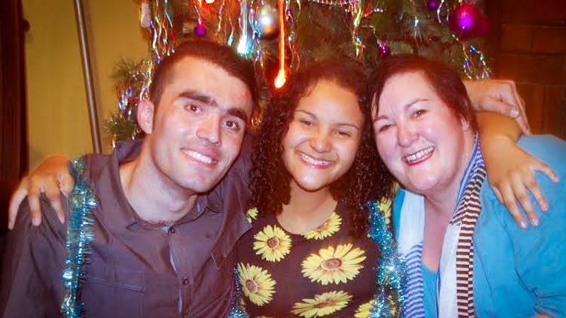 Omid Anwary, Belle Cummins and Christine Cummins seated together at Christine's home in Bendigo, at Christmas 2014.
