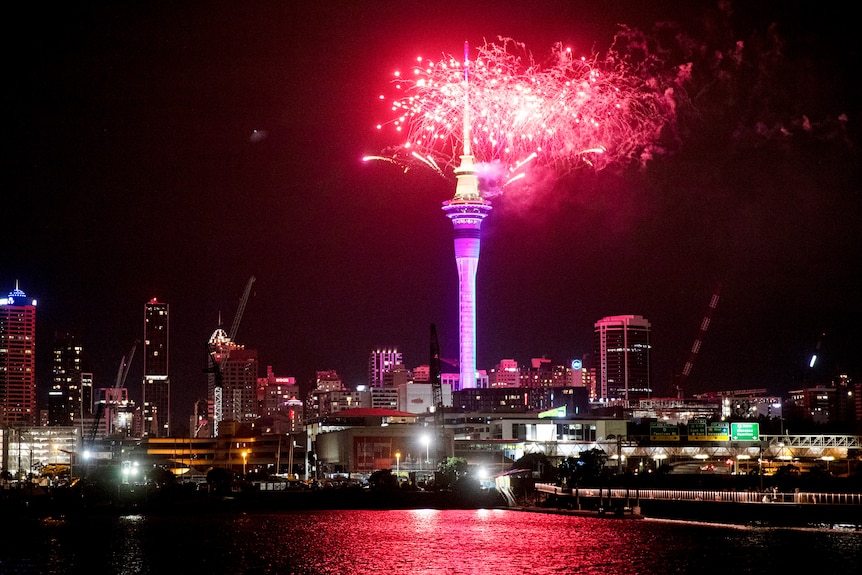 Fireworks explode over Sky Tower in central Auckland.
