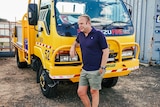 Man leans on rural fire truck