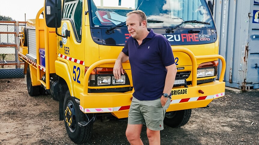 Man leans on rural fire truck