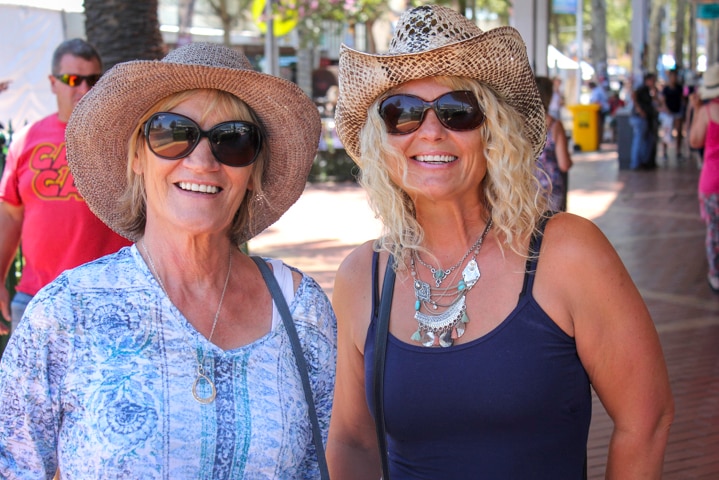 Two ladies from Perth in their hats downtown at the Tamworth Country Music Festival