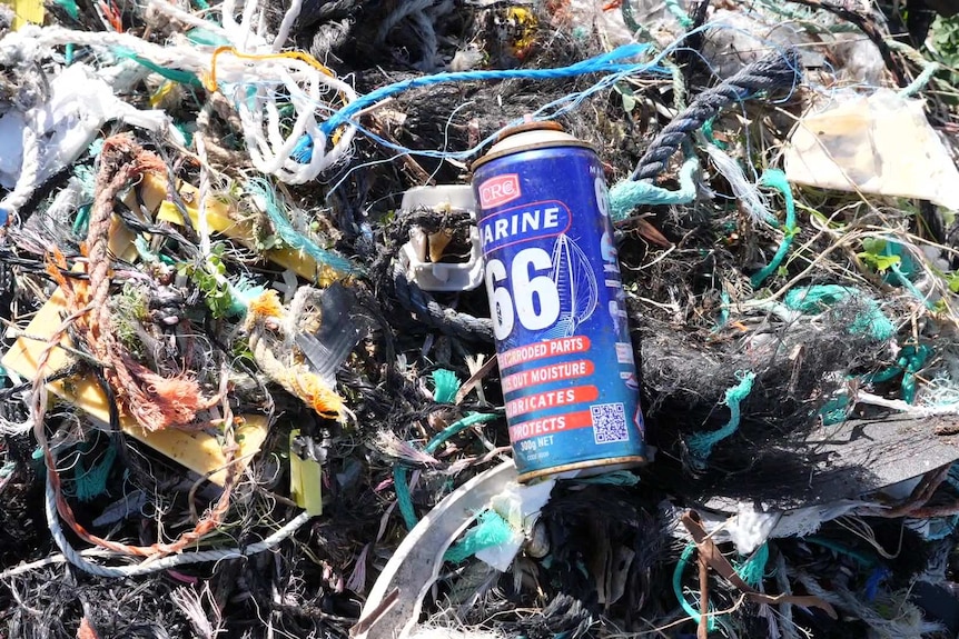 Close up of pile of rope, plastic and can of marine clean