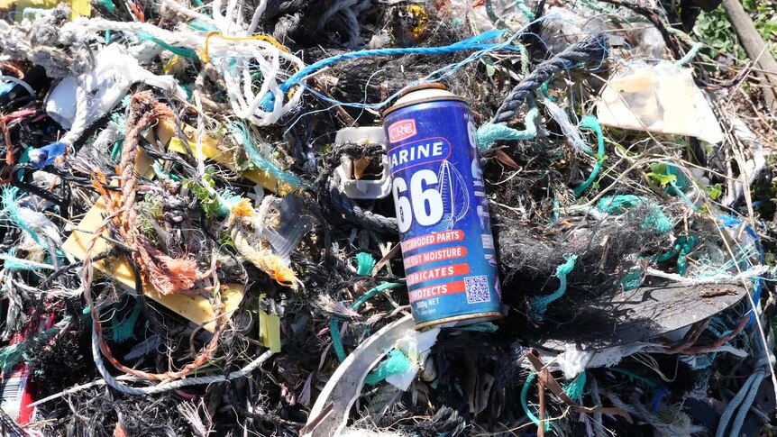 Close up of pile of rope, plastic and can of marine clean