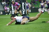 Attacking showcase: Roosters prop Mose Masoe scores the opening try.