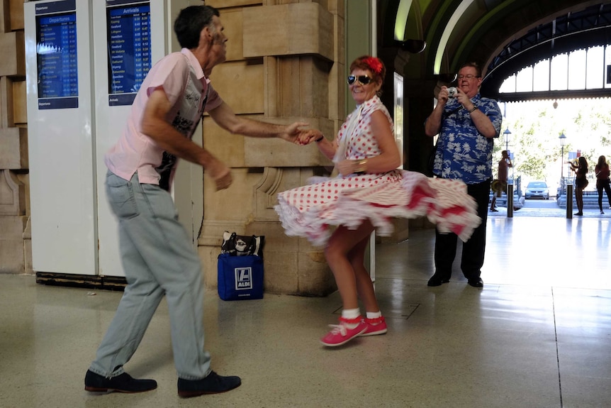 A couple dance to the sounds of Elvis before boarding the train to the annual Parkes Elvis Festival