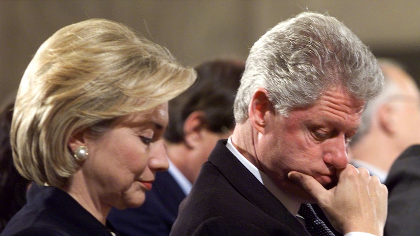 Bill and Hillary Clinton sitting next to each other