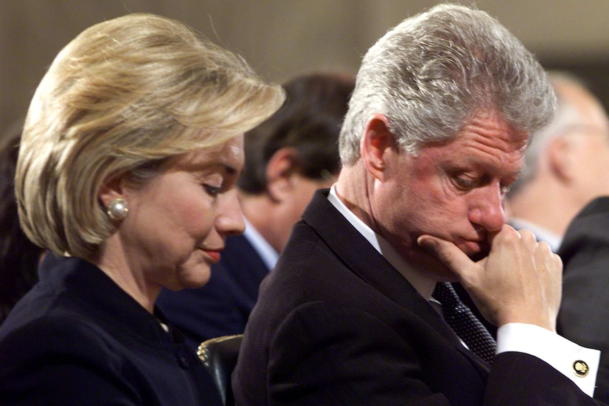 Bill and Hillary Clinton sitting next to each other