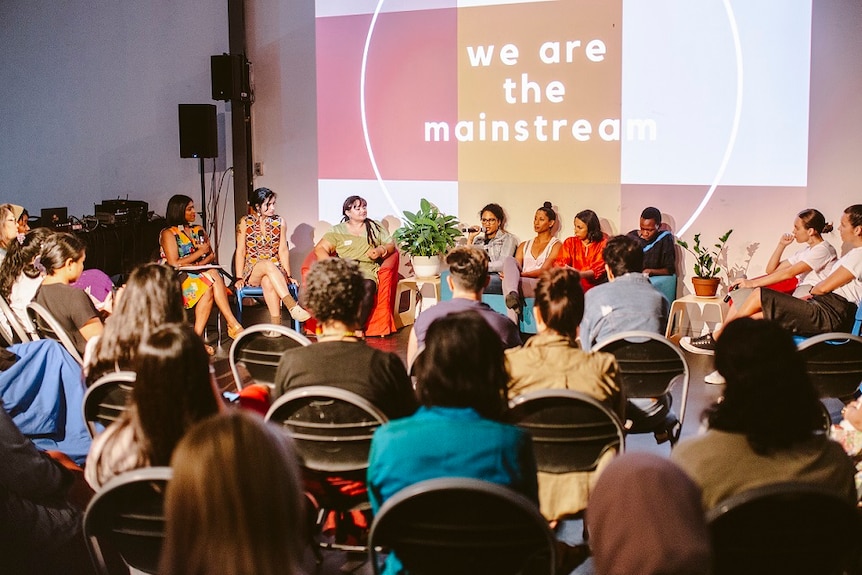 Women speak at an IWD event called We Are The Mainstream.