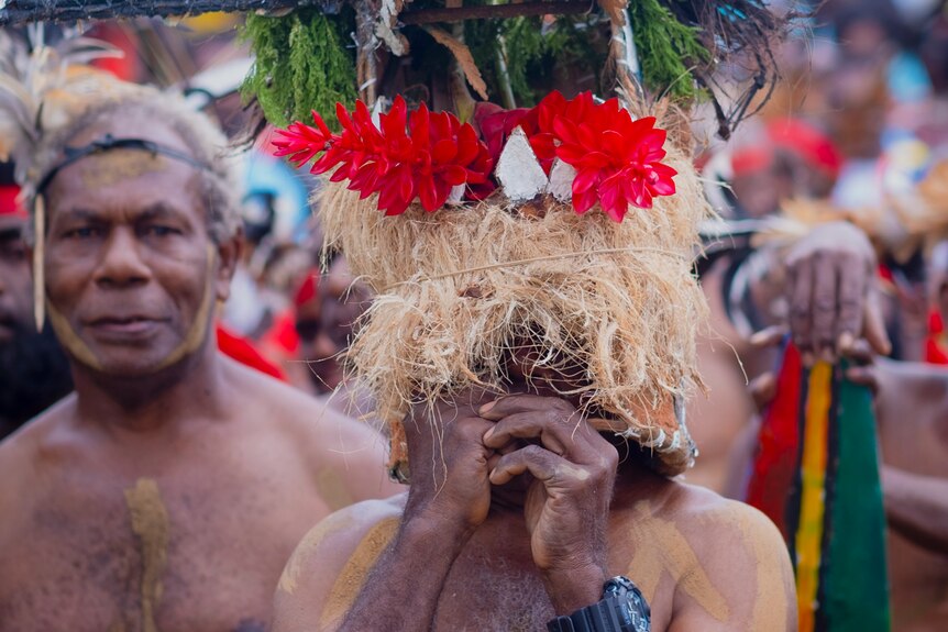 Ni-Vanuatu performers in cultural floral headpieces