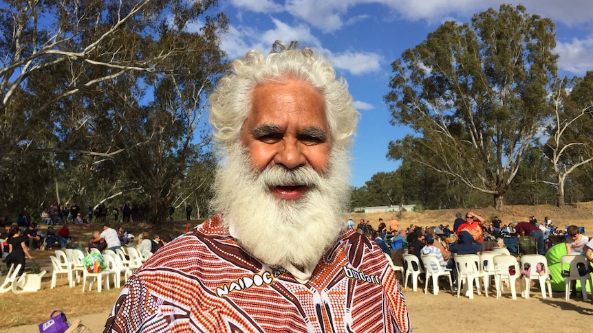 Tumut elder Uncle Pat Connolly in front of crowd at Wagga Wagga corroboree